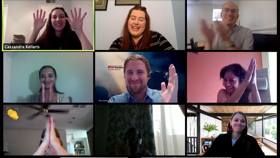 People smiling and clapping on grid of virtual meeting.