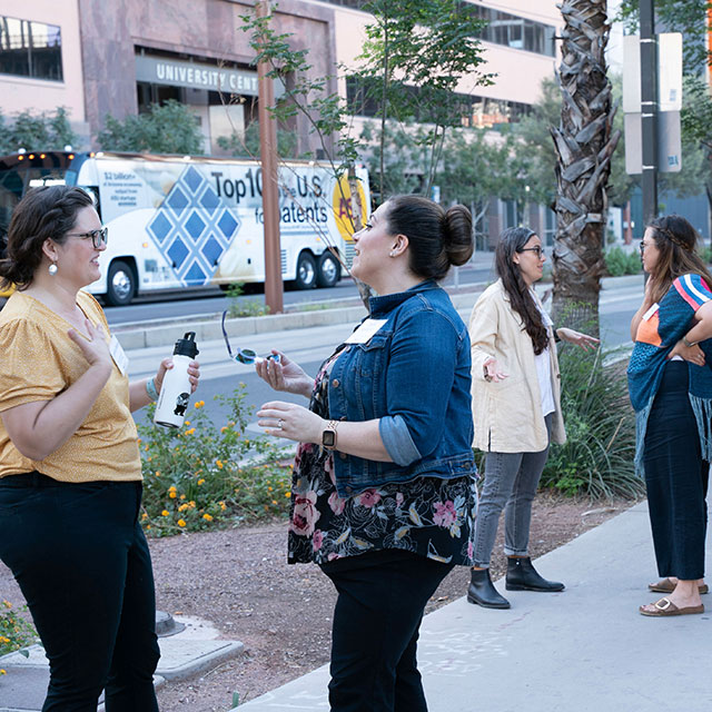 People talking on the sidewalk